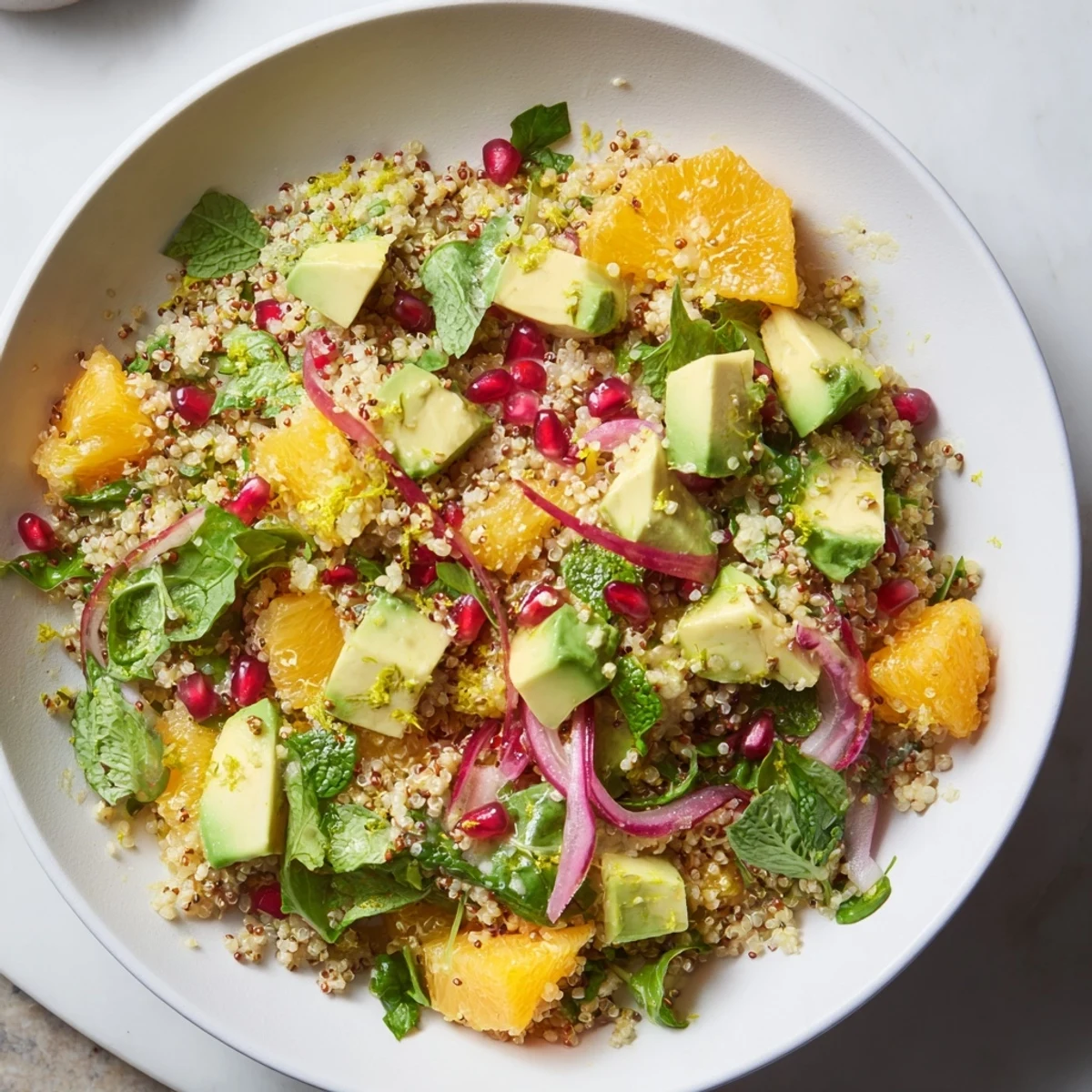Fresh Citrus & Avocado Quinoa Bowl: a beautifully composed salad with juicy citrus and creamy avocado on fluffy quinoa.