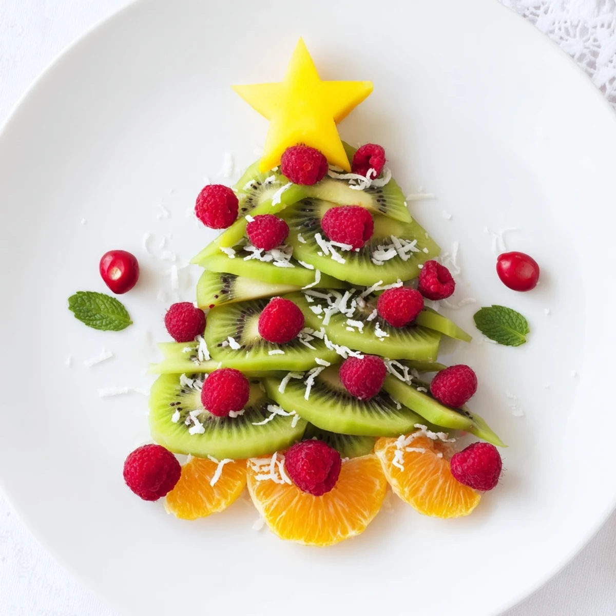 Vibrant Kiwi and Raspberry Christmas Tree Fruit Plate, a colorful festive appetizer, ready to serve and enjoy.