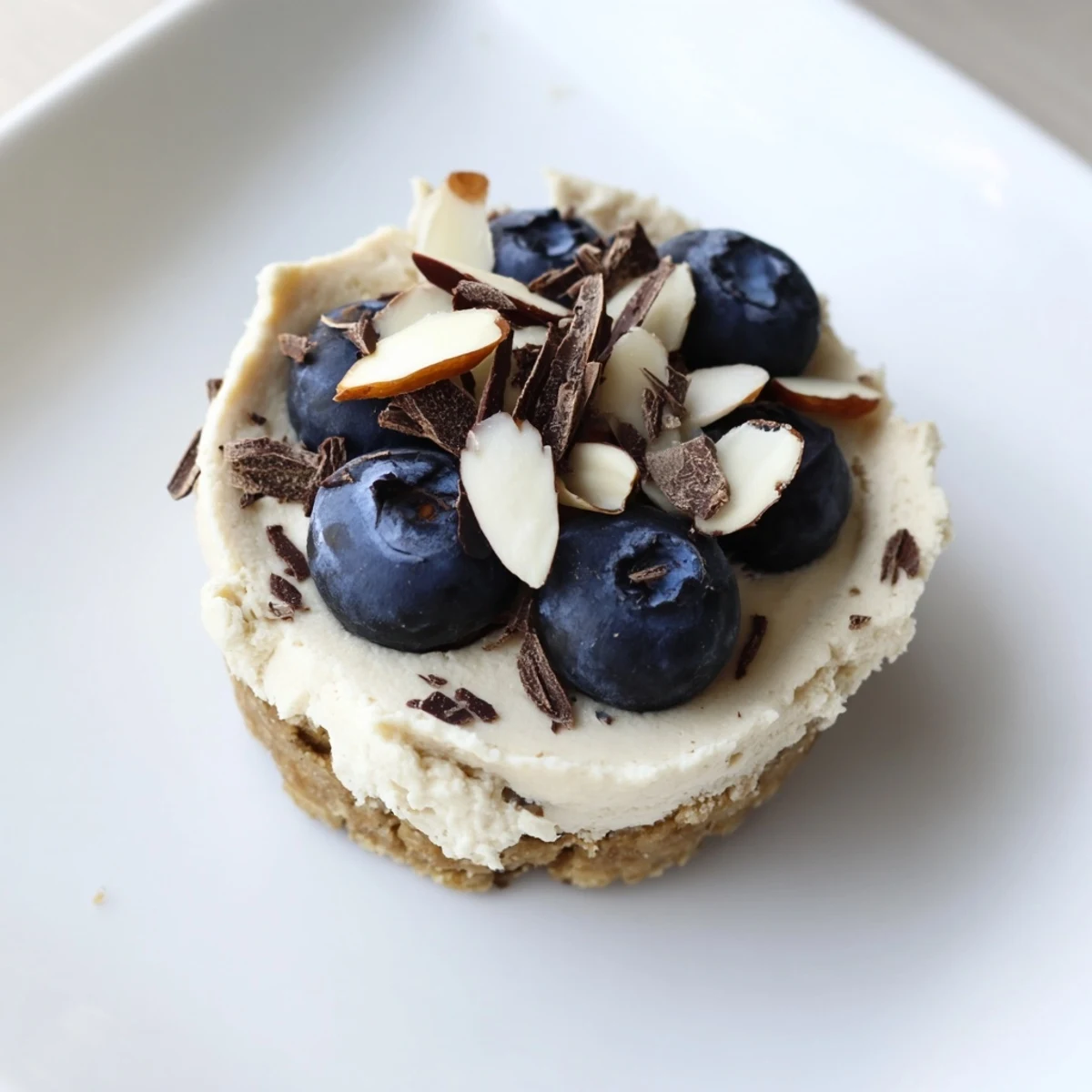No-bake protein cheesecake cups showcase a smooth, light filling over a delightful crunchy base, ideal recipe.