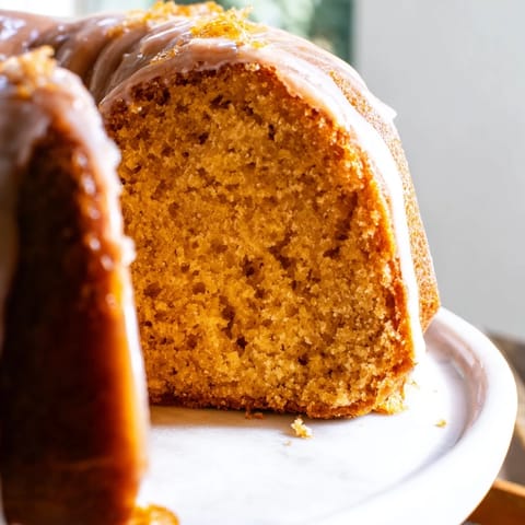 A close-up shot of a tender, golden Soft Glow Honey Pound Cake, perfect for dessert.