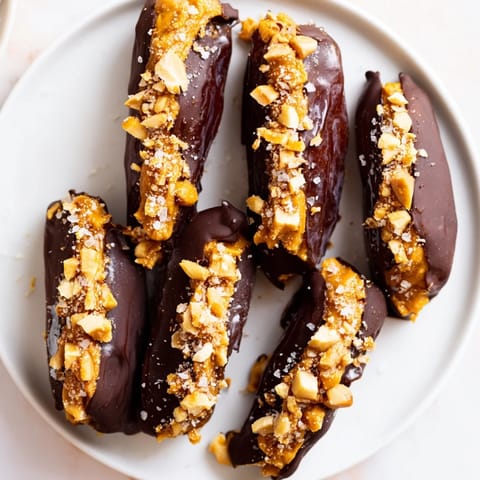 Indulge in these homemade Chocolate Date Snickers, with peanut butter filling and a dark chocolate coating.