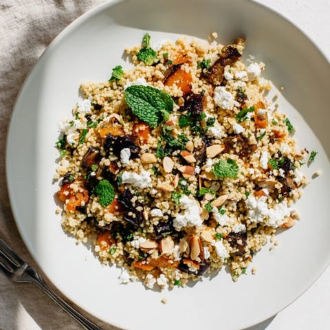 Savory roasted vegetables and aromatic herbs mingle with tender couscous, topped with creamy feta and crunchy toasted pine nuts.  