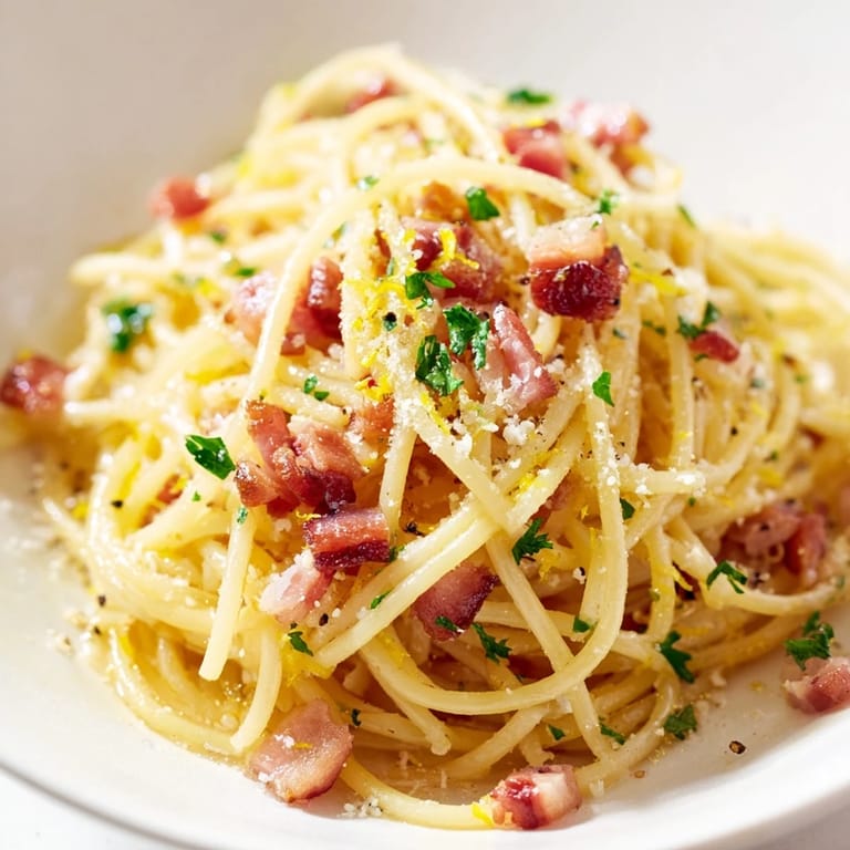 Fresh parsley and lemon zest garnish this Italian-inspired Crispy Bacon Linguine for four hearty servings.