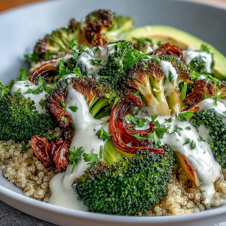 Savory roasted broccoli and onions nestled on warm brown rice for the Roasted Broccoli Bowl, finished with sesame seeds and fresh parsley.